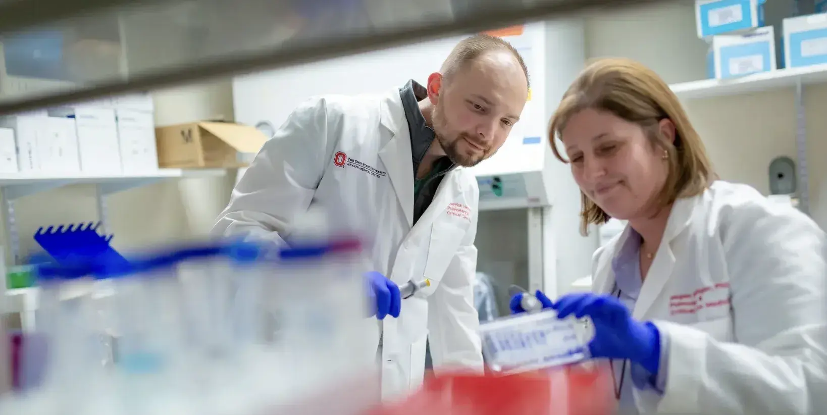 Two investigators working in a lab